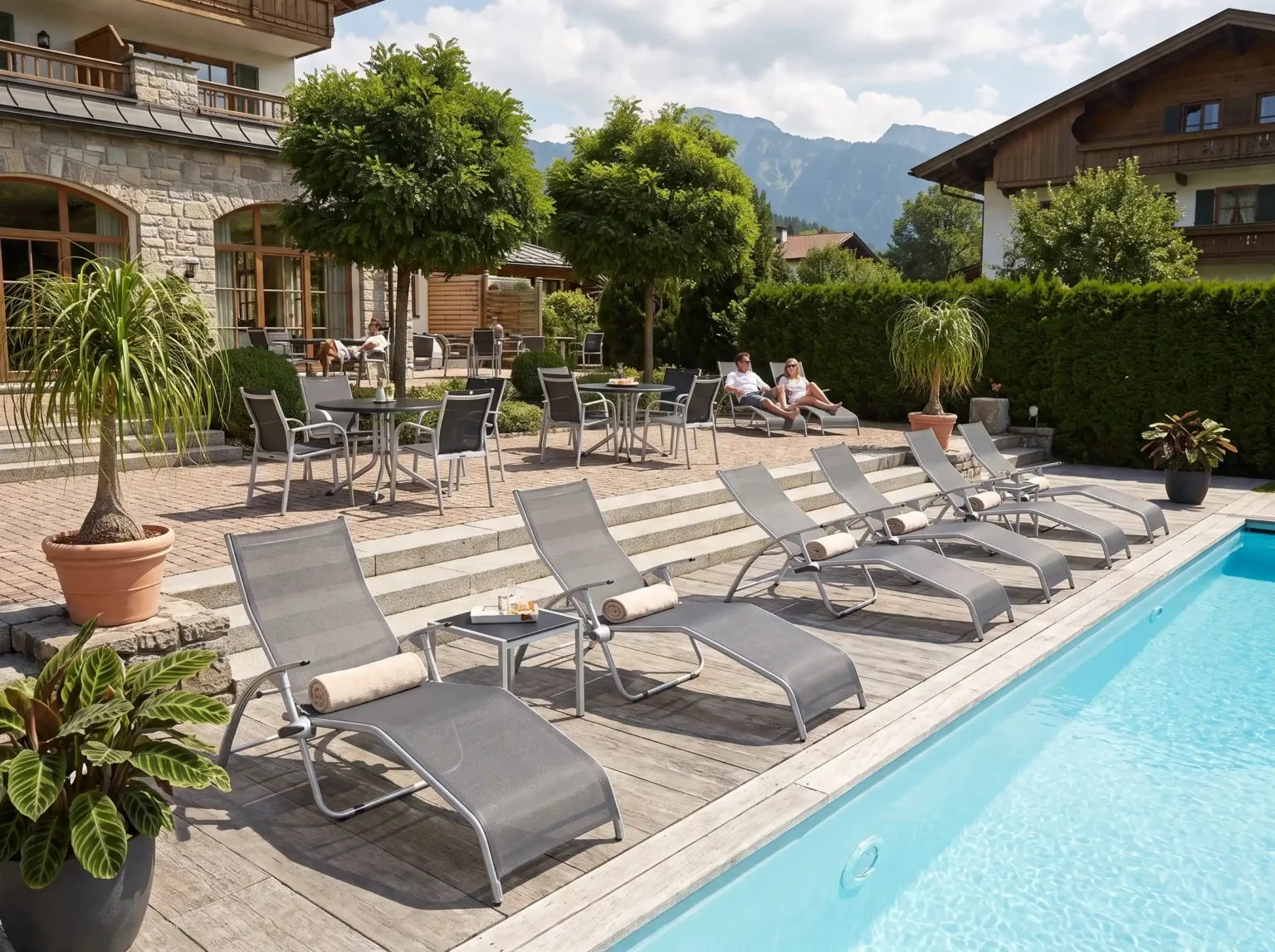 Kettler lifestyle image: loungers by the pool of a hotel resort